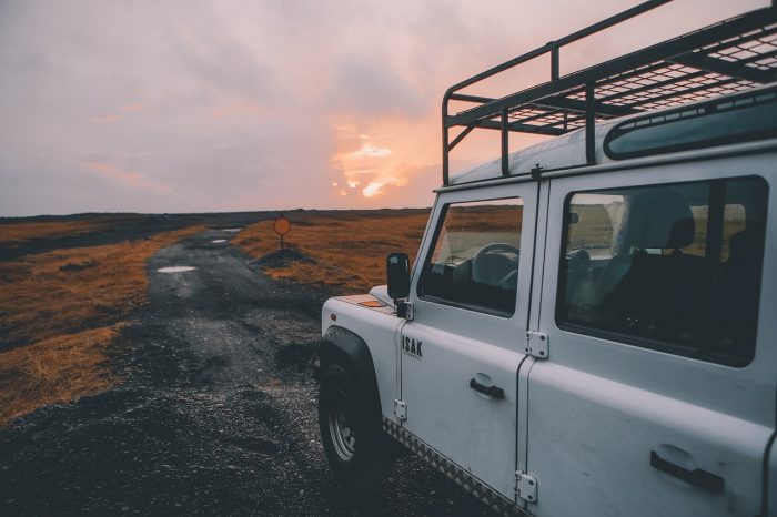image of a jeep and a rough road ahead
